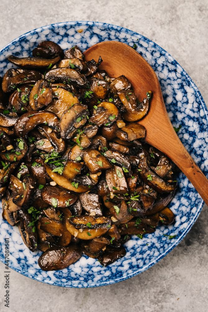 Fototapeta premium Plate of sautéed cremini mushrooms