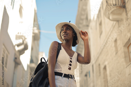 beautiful woman walks down the street