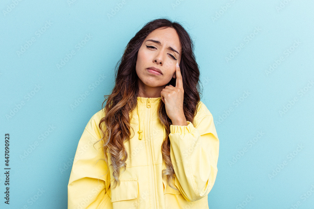 Young mexican woman isolated on blue background crying, unhappy with something, agony and confusion concept. Young mexican woman isolated on blue background crying, unhappy with something, agony and confusion concept.