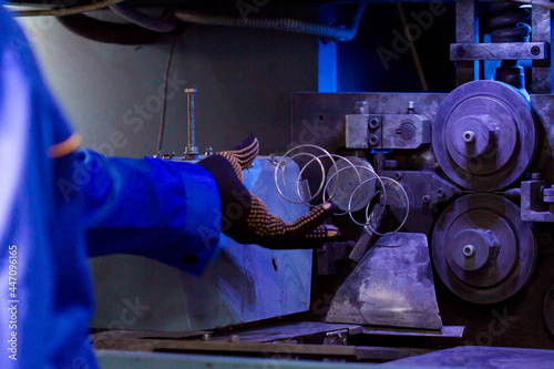 Production of independent springs for mattresses. Independent spring blocks packed in spunbond. Coiling and hardening of springs. Furniture manufacture. Industrial and business concept.