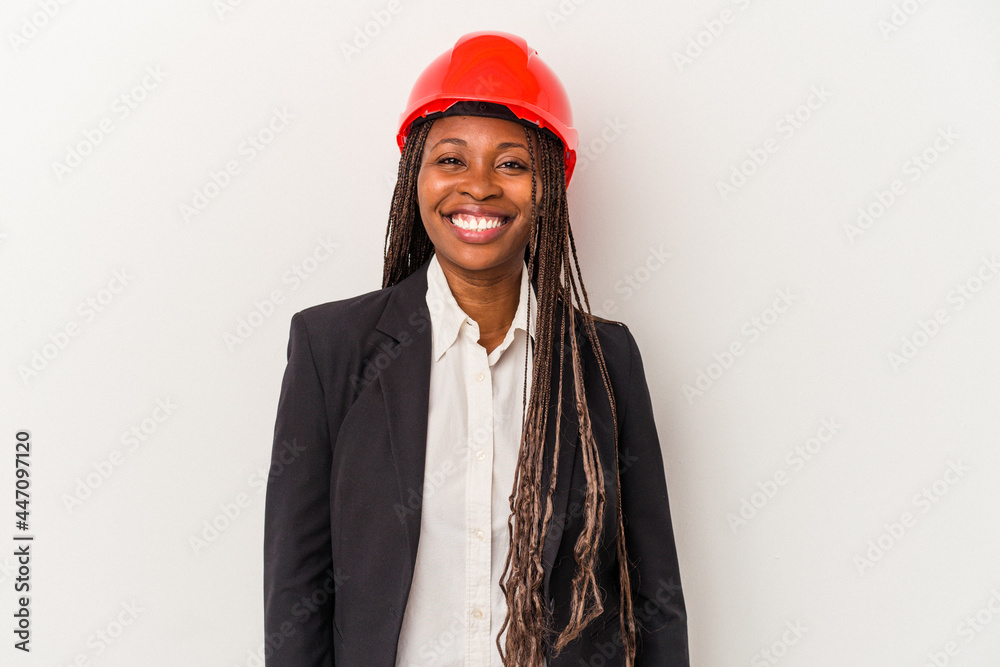Young african american architect woman isolated on white background happy, smiling and cheerful. Young african american architect woman isolated on white background happy, smiling and cheerful.