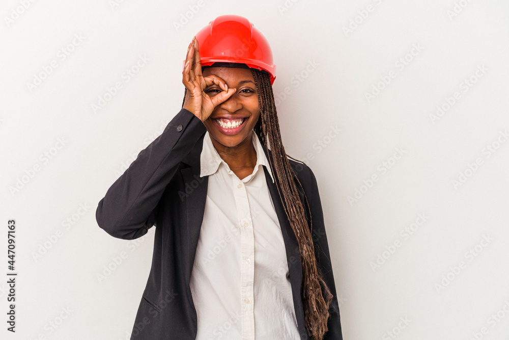 Young african american architect woman isolated on white background excited keeping ok gesture on eye. Young african american architect woman isolated on white background excited keeping ok gesture on eye.