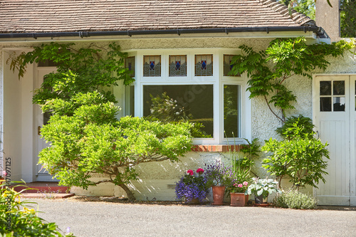 View of brightly Irish house front with traditional colored england entrance door.