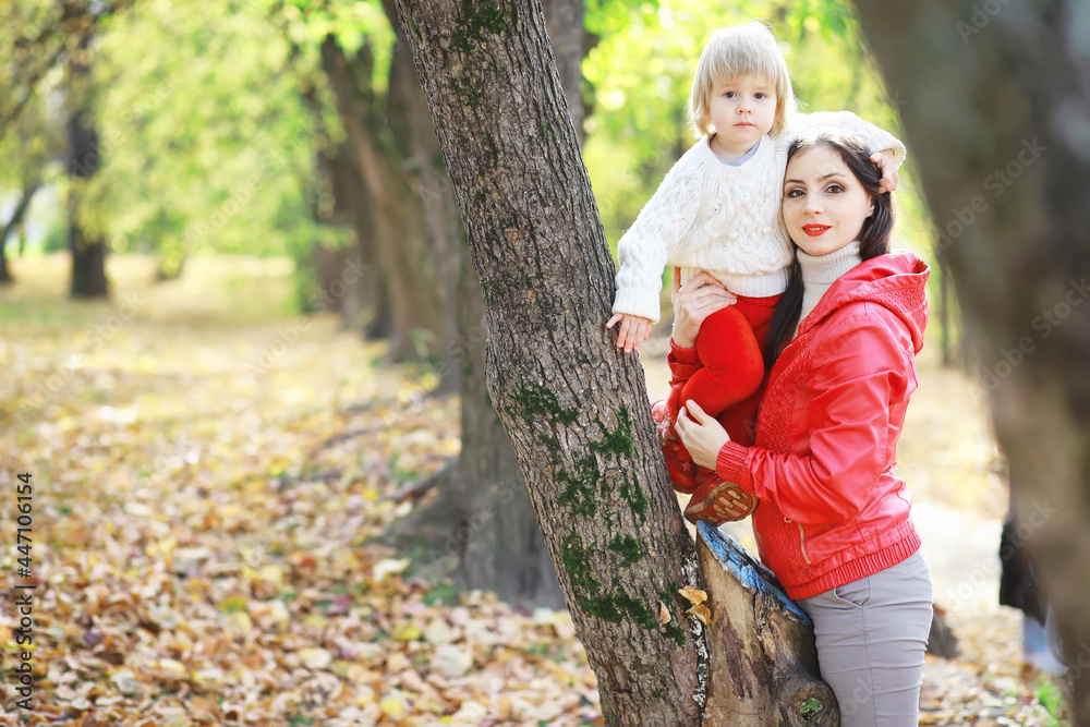 Children for a walk in the autumn park. Leaf fall in the park. Family. Fall. Happiness. Children for a walk in the autumn park. Leaf fall in the park. Family. Fall. Happiness.
