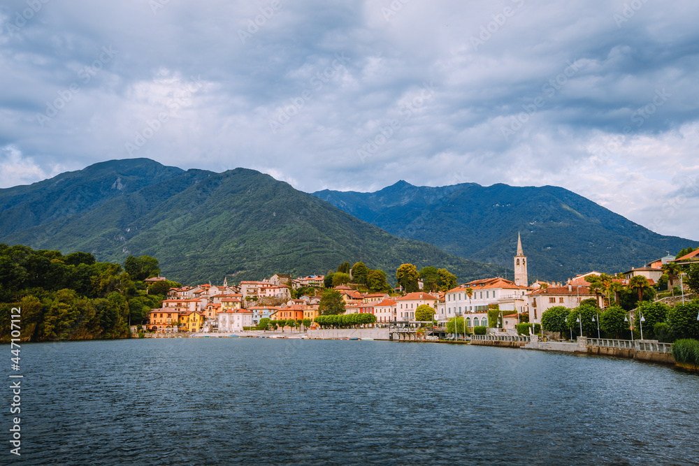 Mergozzo, Verbania / Italy - June 2021: View of the village of Mergozzo on the homonymous lake with cloudy sky