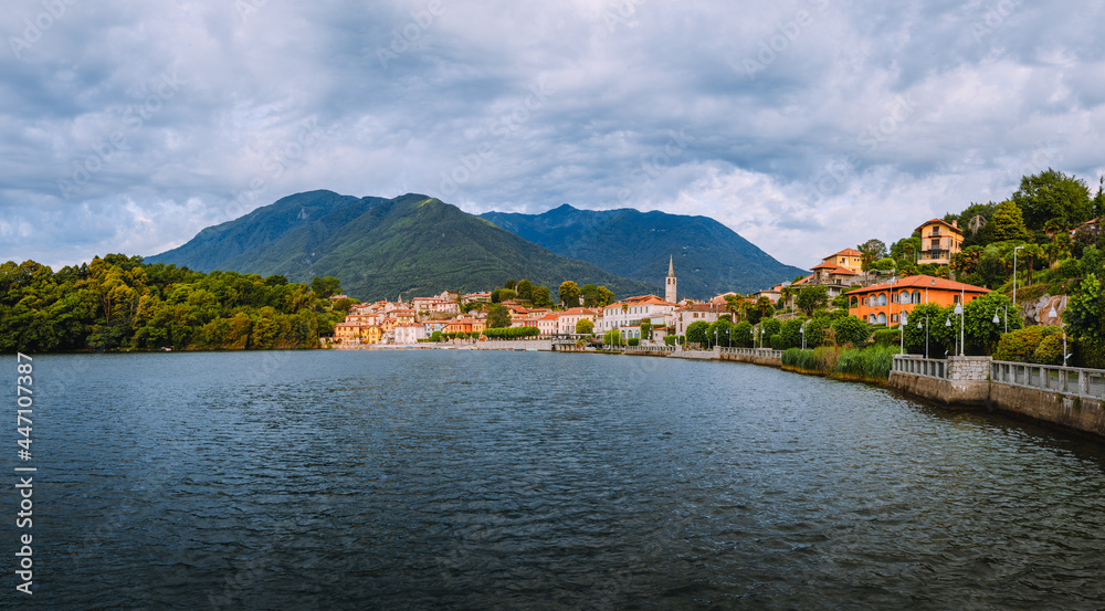 Mergozzo, Verbania / Italy - June 2021: View of the village of Mergozzo on the homonymous lake with cloudy sky