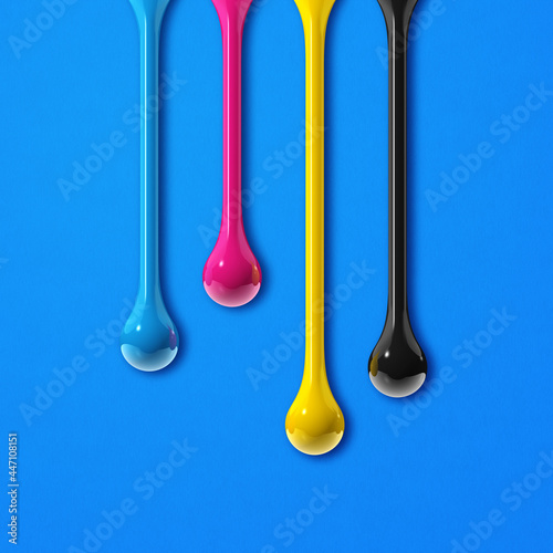 cmyk ink drops on blue paper square background