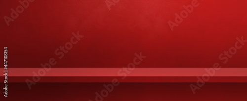 Obraz na plátne Empty shelf on a red wall. Background template. Horizontal banner