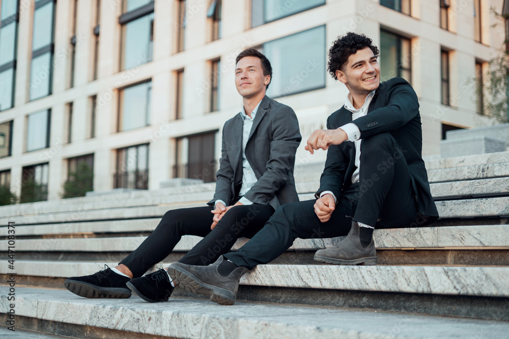 Confident professional economists discuss further actions on the project. Lawyers to the new office. Business and youth concept. Confident professional economists discuss further actions on the project. Lawyers to the new office. Business and youth concept.