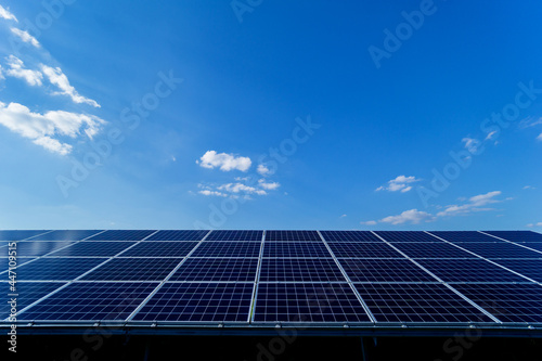 Photovoltaic solar panels on blue sky background