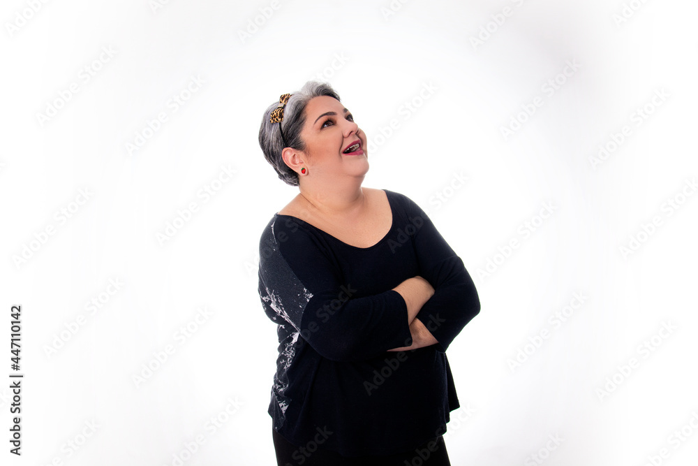 People diversity young lady with arms crossed white hair looking up wearing black on white background People diversity young lady with arms crossed white hair looking up wearing black on white background