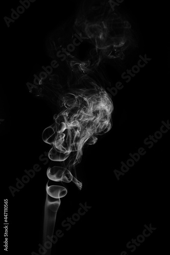 Black and white photo of smoke clouds on a black background