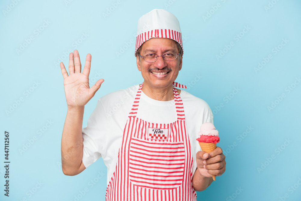 Senior american ice cream man holding an ice cream isolated on blue background smiling cheerful showing number five with fingers.