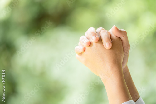 Hands folded in prayer © doidam10