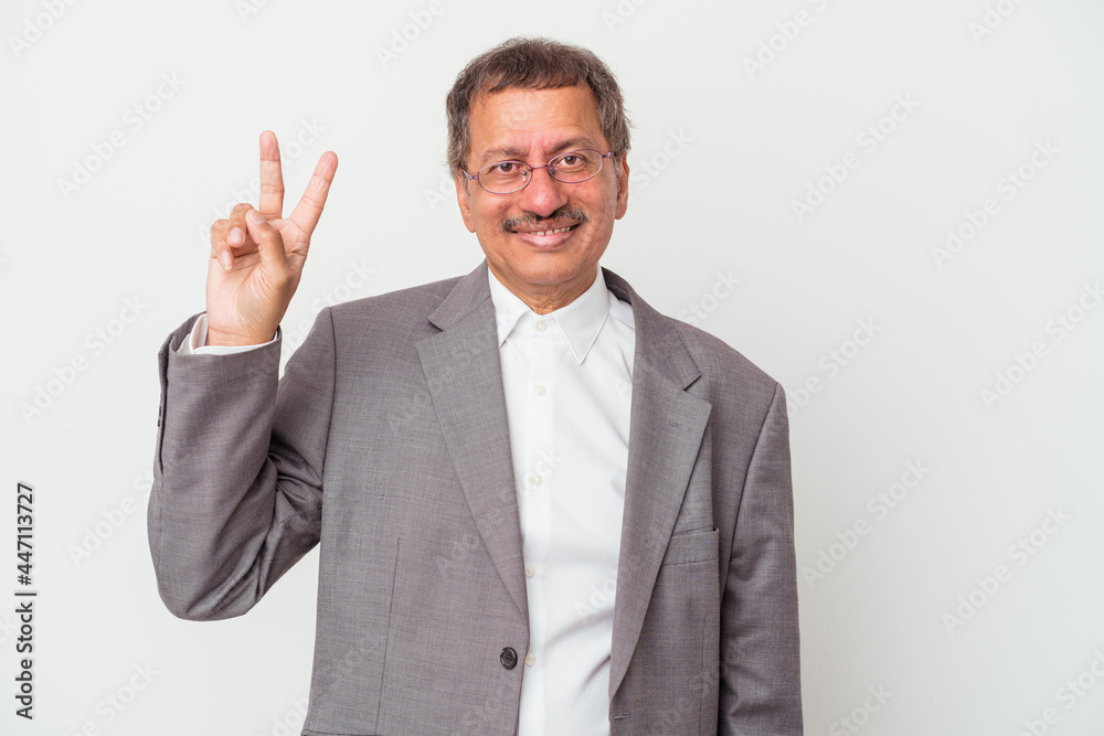 Middle aged indian business man isolated on white background showing number two with fingers. Middle aged indian business man isolated on white background showing number two with fingers.