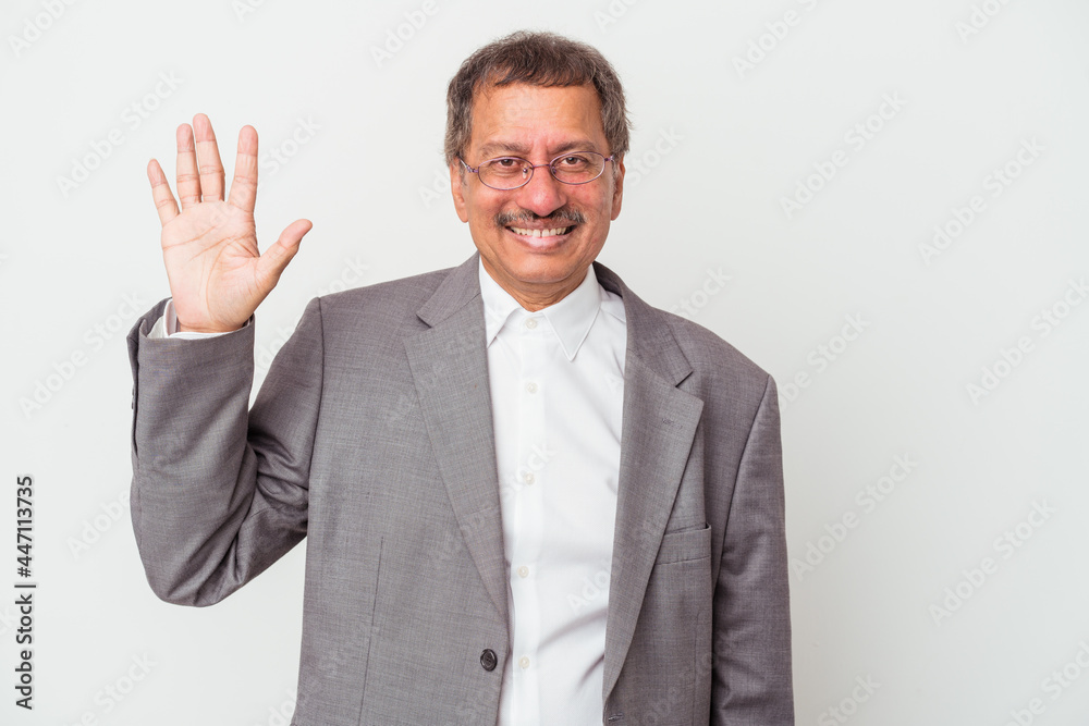 Middle aged indian business man isolated on white background smiling cheerful showing number five with fingers. Middle aged indian business man isolated on white background smiling cheerful showing number five with fingers.