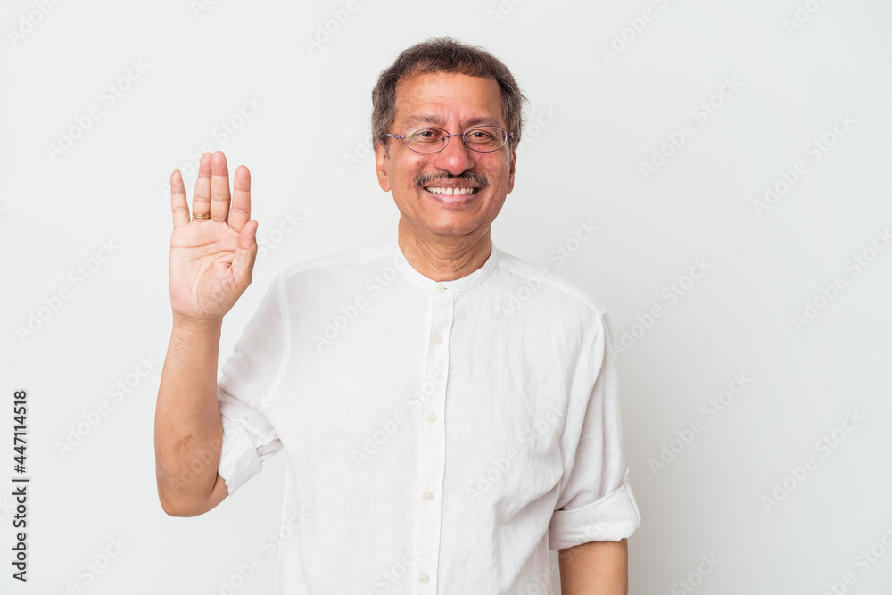 Middle aged indian man isolated on white background smiling cheerful showing number five with fingers. Middle aged indian man isolated on white background smiling cheerful showing number five with fingers.