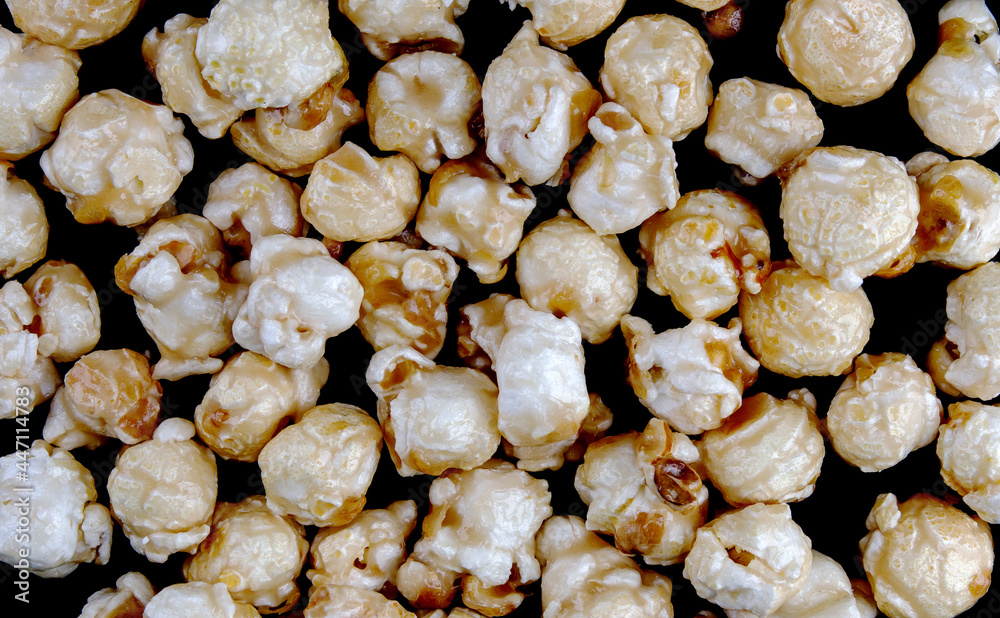 Popcorn background. popcorn surface. Popcorn in caramel glaze. Popcorn background. popcorn surface. Popcorn in caramel glaze.