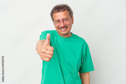 Middle aged indian man isolated on white background smiling and raising thumb up