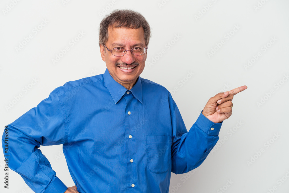 Middle aged indian man isolated on white background smiling cheerfully pointing with forefinger away.