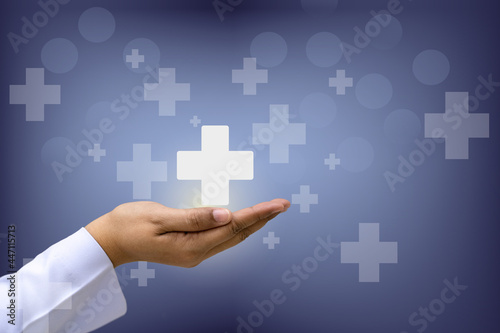 Hand holding plus sign virtual means to offer positive thing (like benefits, personal development, social network, health insurance) with copy space