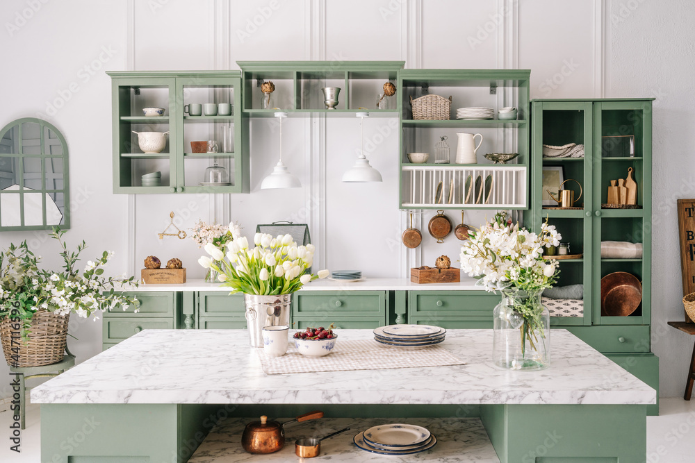 Obraz na płótnie Comfortable apartment kitchen interior with green furniture w salonie