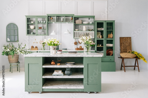Kitchen decor with green furniture and island