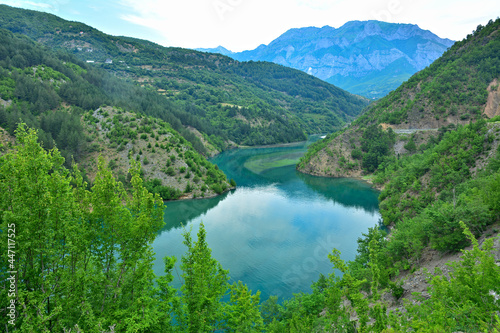 The turquoise waters of Koman Lake surrounded by the mountains