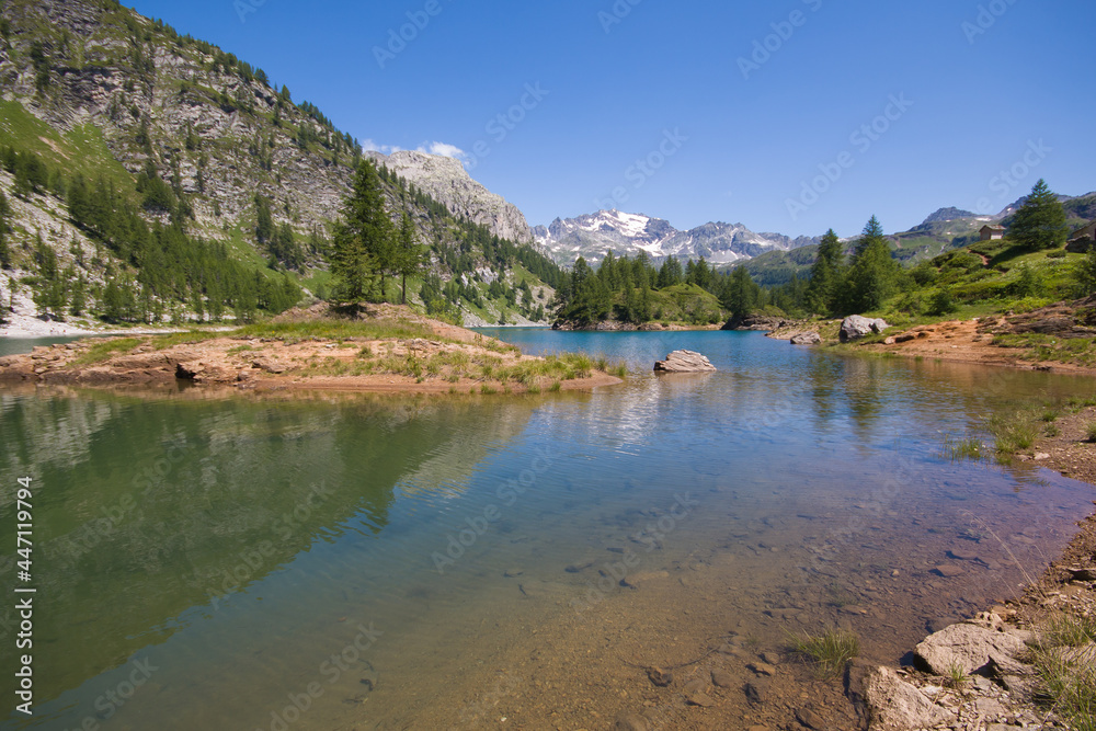 View of Devero alp and lake Codelago in a beautiful day of summer season with blue sky in background, Piedmont - Italy