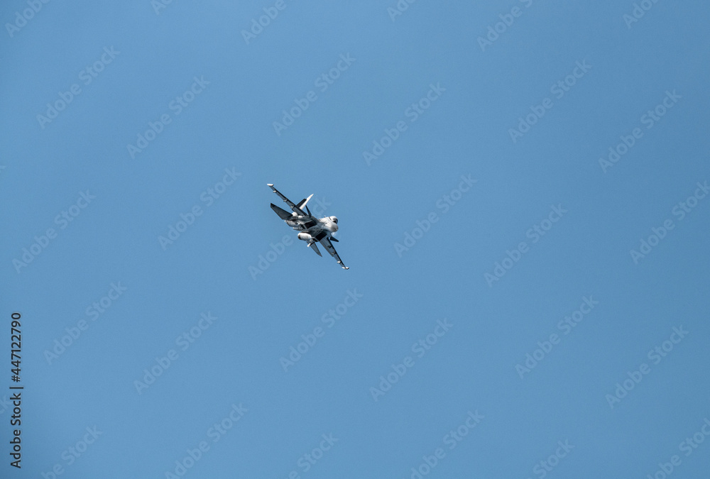combat aircraft makes difficult turns in the air against the background of the sky combat aircraft makes difficult turns in the air against the background of the sky