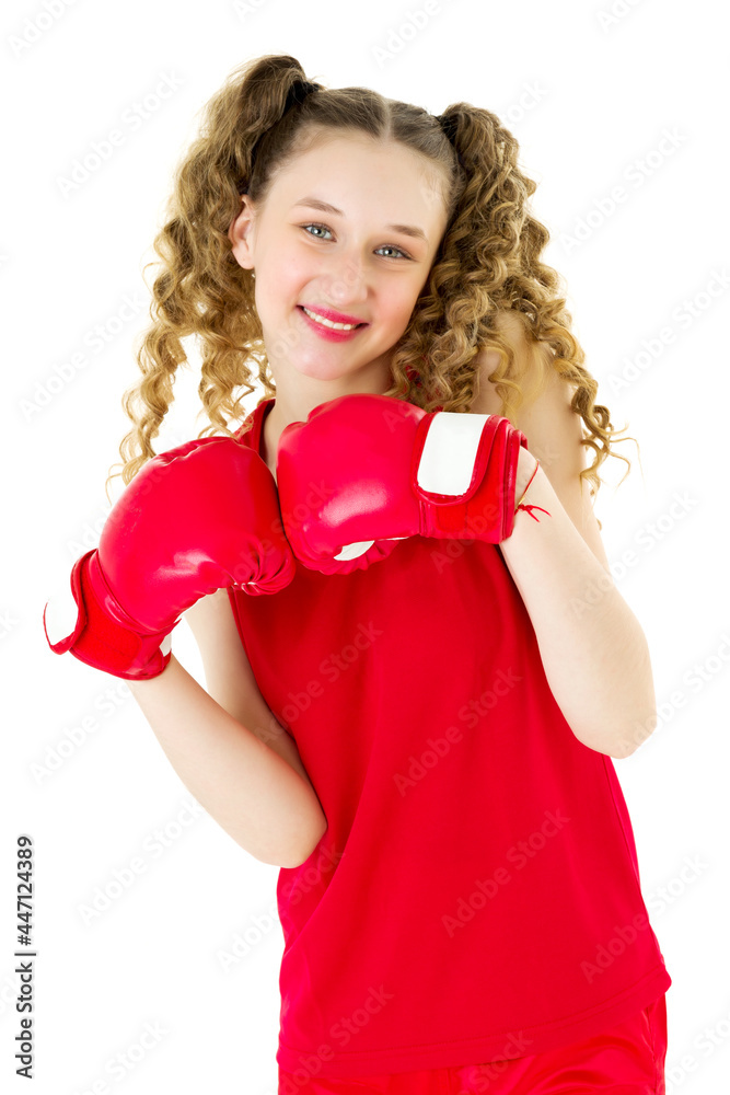 Happy teenage girl posing in red boxing gloves Happy teenage girl posing in red boxing gloves