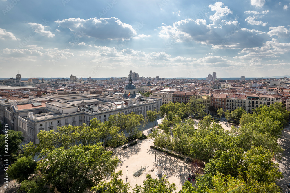Panoramic view of the noble area of the city of Madrid with a beautiful wooded park in the foreground