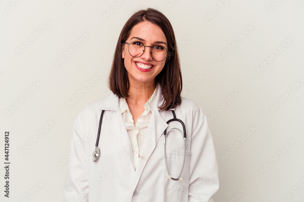 Young doctor caucasian woman isolated on white background happy, smiling and cheerful. Young doctor caucasian woman isolated on white background happy, smiling and cheerful.