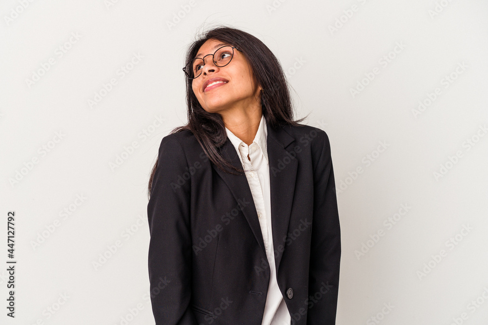 Young business latin woman isolated on white background dreaming of achieving goals and purposes Young business latin woman isolated on white background dreaming of achieving goals and purposes