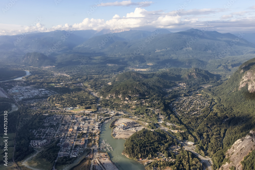 Obraz premium Aerial View from Airplane of a small touristic town, Squamish. Sunny Summer. Located in Howe Sound, North of Vancouver, British Columbia, Canada.