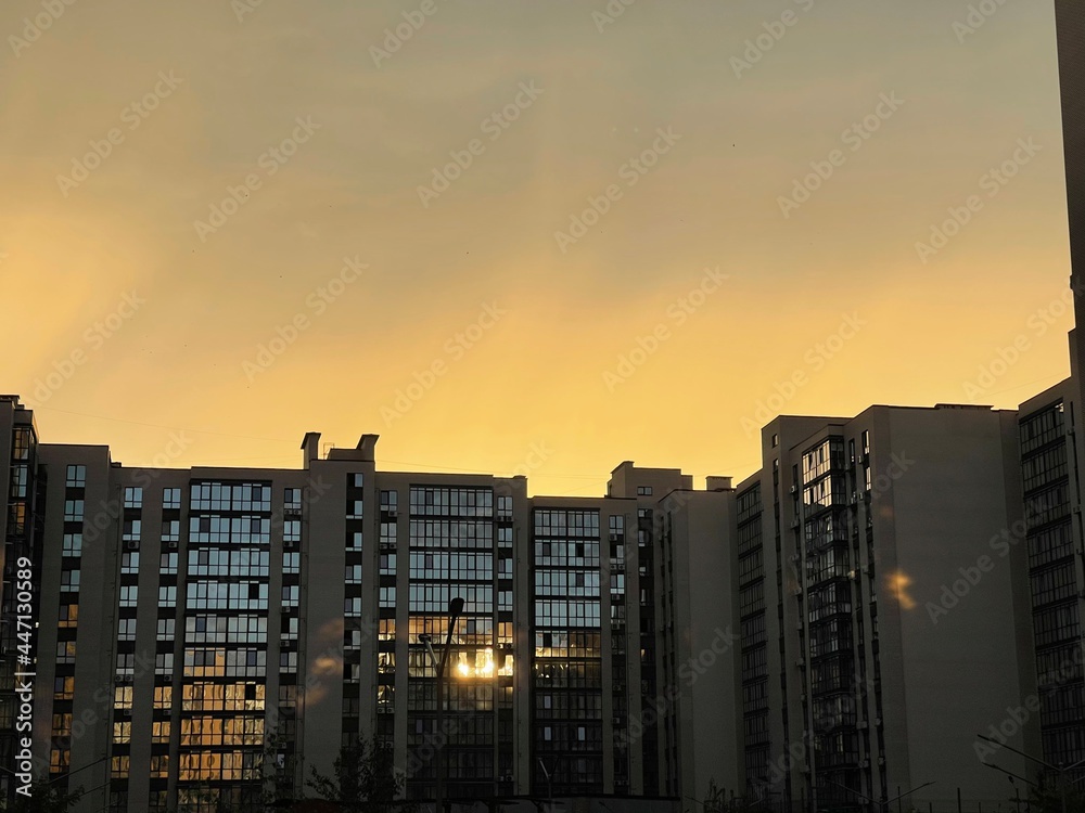 sunset on the background of a new high-rise building sunset on the background of a new high-rise building
