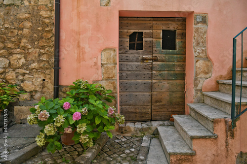 The facade of an old house in Maenza, a medieval town in the Lazio region, Italy.