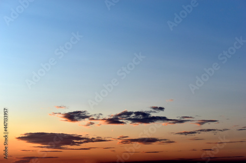 Blue pink evening sky with clouds in summer