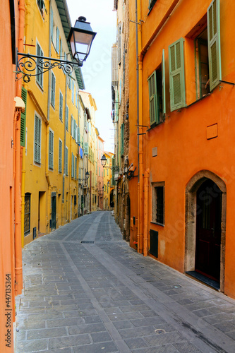 Vibrant narrow street in the French Riviera town of Menton