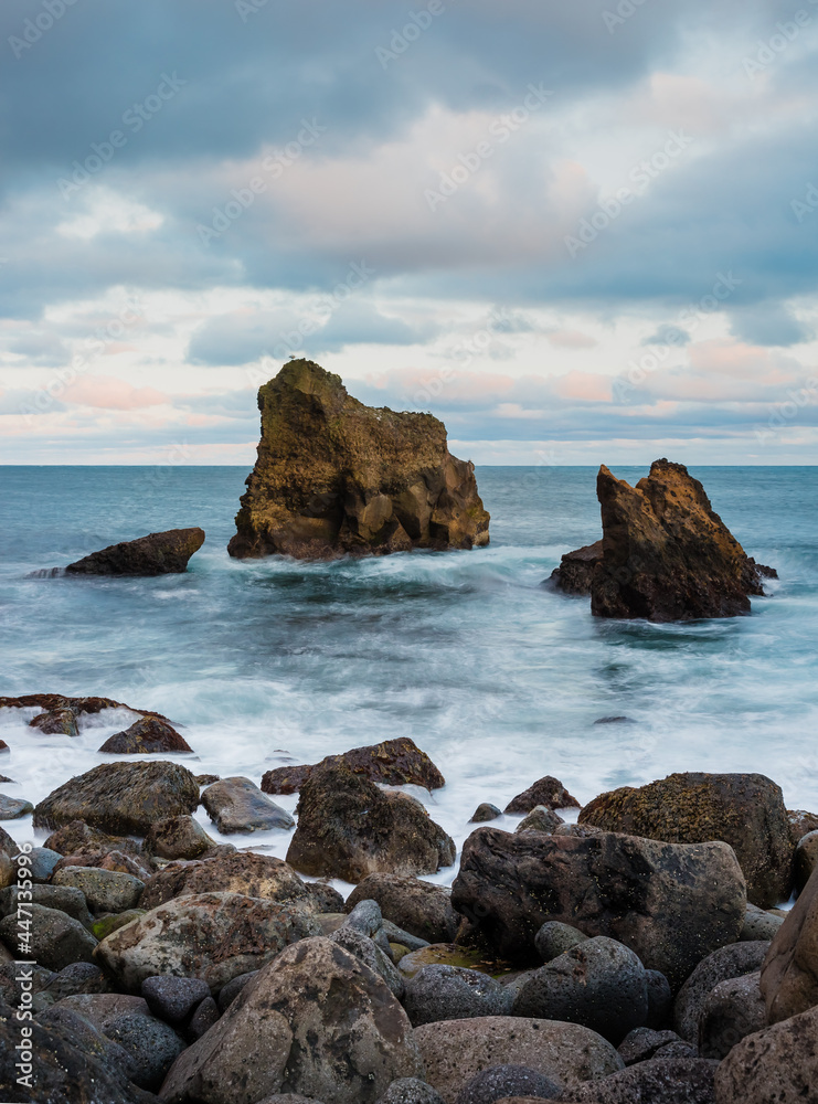Icelandic wild coast with large rocks on the beach Icelandic wild coast with large rocks on the beach