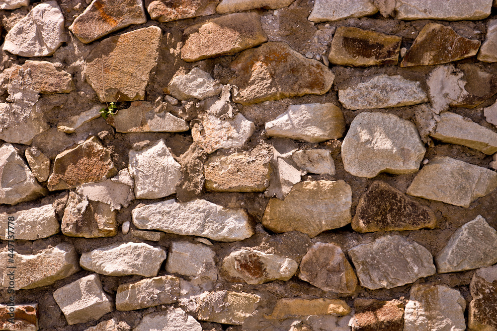 Fototapeta premium Gross masonry with cement. Stone wall texture. Rough background.