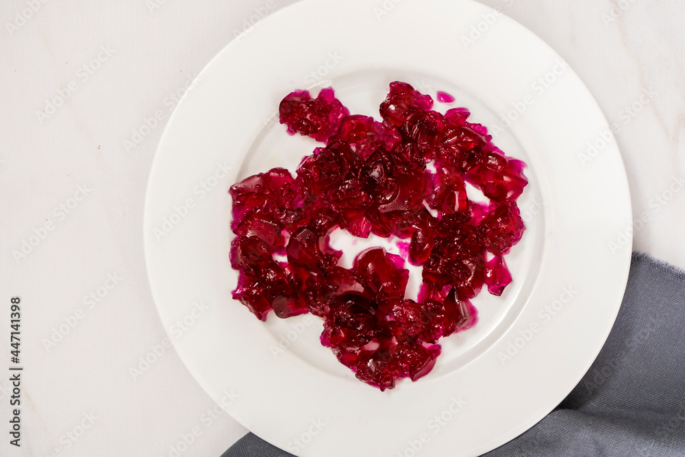 Raspberry jelly on a white plate. Raspberry jelly on a white plate.