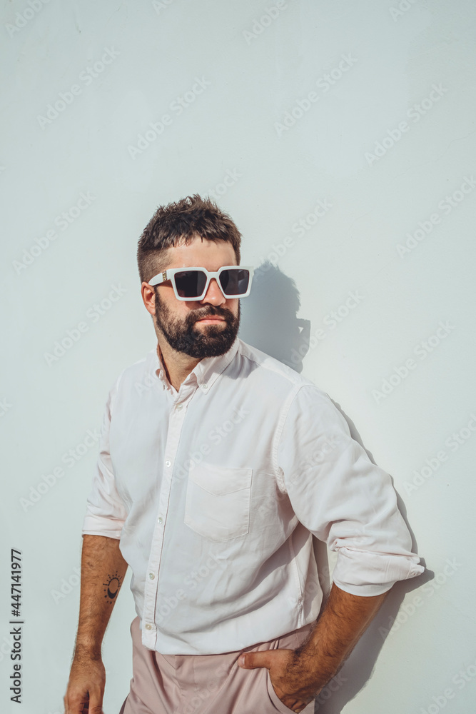 Handsome beard man posing in the street, near with wall, sunglasses, hipster style, outdoor portrait, fashion model, happy face, Handsome beard man posing in the street, near with wall, sunglasses, hipster style, outdoor portrait, fashion model, happy face,