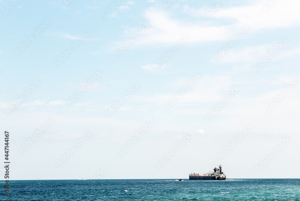 Ship on the crisp blue water with lots of sky and room for text. Ship on the crisp blue water with lots of sky and room for text.