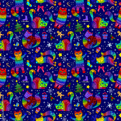 Seamless pattern on the theme of new year and Christmas with bright cats and toys on a blue background