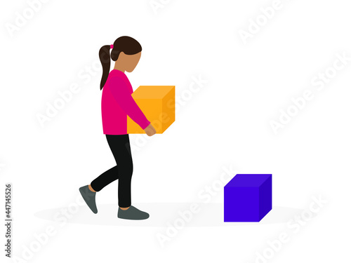 A little girl with a large cube in her hands goes to a cube lying on the floor