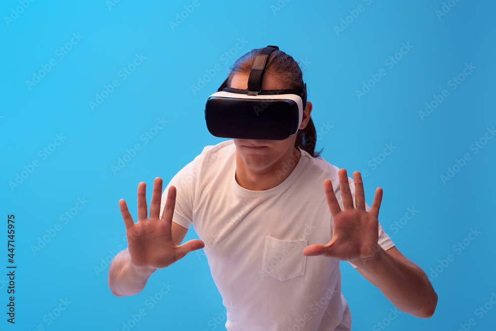 Naklejka premium Young man using virtual reality headset. VR gadgets
