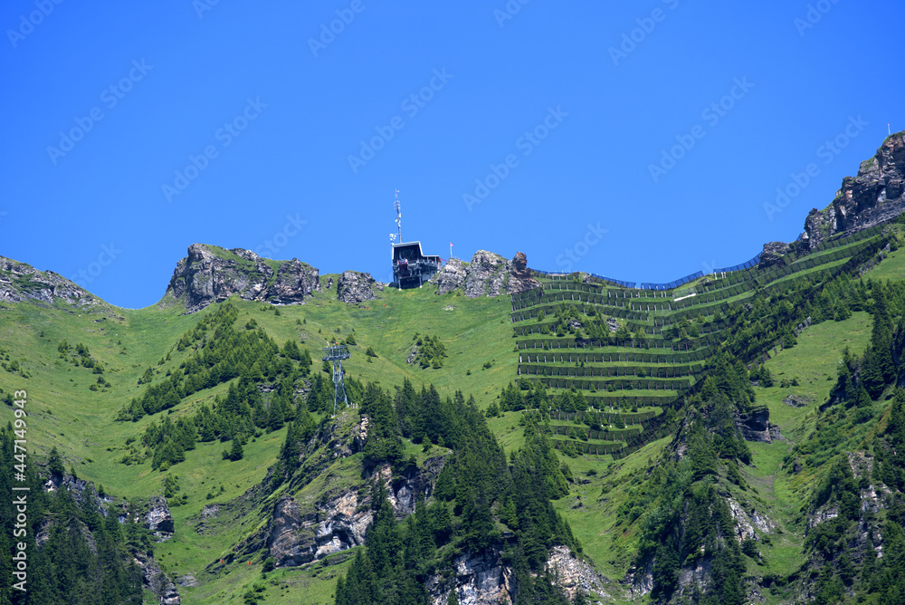 Fototapeta premium Landscape in the mountains at Bernese highland on a beautiful summe day. Photo taken July 20th, 2021, Lauterbrunnen, Switzerland.