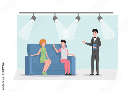 Smiling TV host in suit interviewing celebrity persons in studio vector flat illustration. Famous man and woman sitting on sofa front of standing man. TV broadcasting, journalist talks to celebrities. photo