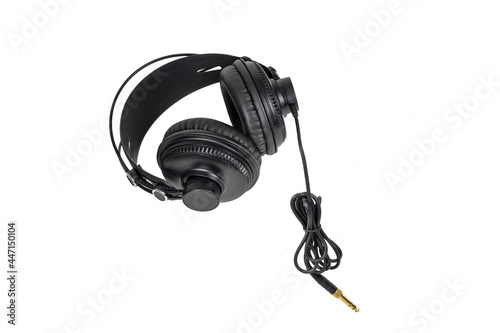 black headphones with cable isolated on white background